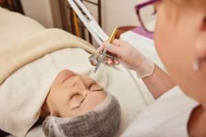 Charming woman having oxygen mesotherapy procedure in clinic