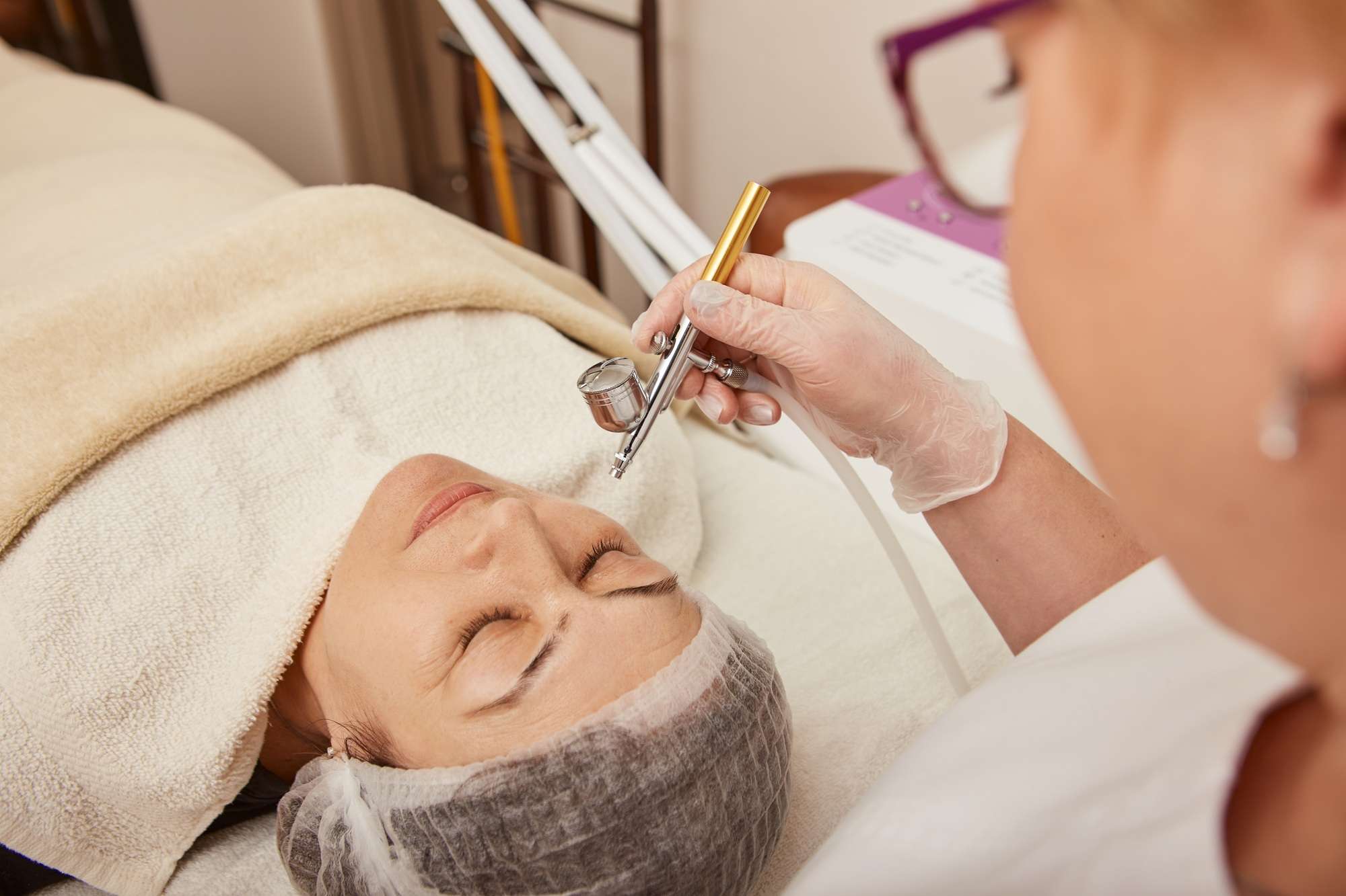 Charming woman having oxygen mesotherapy procedure in clinic