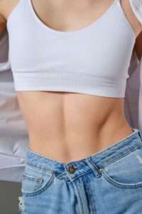 Toned female belly with beautiful abdominal muscles
